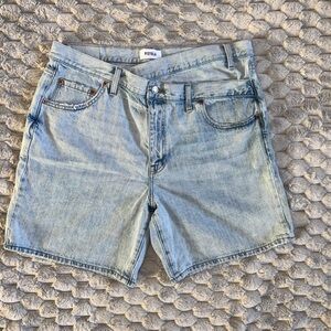 Pistola Denim shorts featuring a unique crossover waist and raw hem